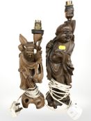 A pair of Japanese carved hardwood table lamps, tallest 43 cm.