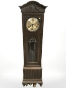 A 1920's continental oak regulator clock with weights.