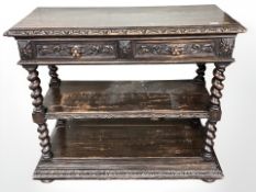A 19th century carved oak dumbwaiter, fitted with two drawers, width 112 cm.