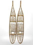 A pair of vintage snow shoes,