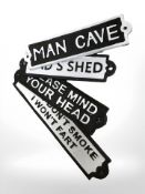 Four cast iron signs.