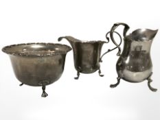 A silver cream jug, Chester, 1905, together with a silver sugar bowl and further silver cream jug.