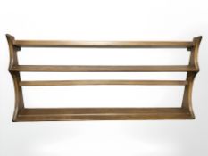 An Ercol plate rack, width 97 cm.