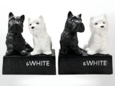 A pair of Black & White scotch whisky advertising cast iron figures.