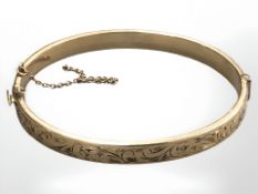A 9ct rolled gold bangle, diameter 50 mm x 58 mm.
