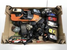 A box of mobile telephones, die cast vehicles on stand, a remote control Lamborghini,
