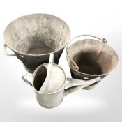 A brass jam pan together with an iron skillet, galvanised watering can and two large metal buckets.