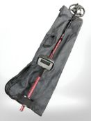 A Minelab metal detector in carry case.