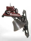 A cast iron tractor bell on bracket.