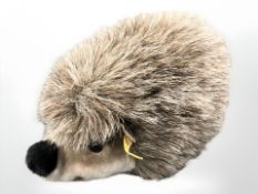 A Steiff hedgehog, together with an antique mohair teddy bear.