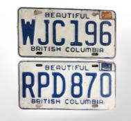 Two British Columbia metal car registration plates.