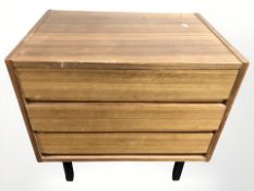 A mid 20th century teak three drawer chest,