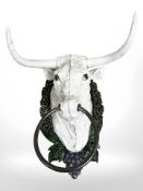 A cast iron bull tower holder.