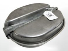A World War II stainless steel mess tin.