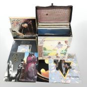 A box of vinyl records including War of the Worlds, Stevie Wonder, Elvis, Grace Jones, Shakatak,