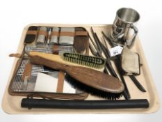 A group of French glove stretchers, silver plated tankard, cowhide purse, gents travel set, brushes,