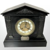 A Victorian slate mantel clock.