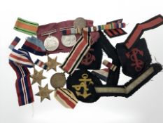 A group of World War II Defence medals, award ribbons, etc.