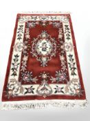 A Chinese carpet on red ground,