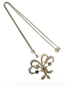 An Edwardian yellow gold pendant set with seed pearls and rubies,