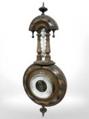 A Victorian carved walnut barometer.