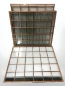 Six copper framed panels of glass.