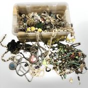 A box containing a large quantity of beads, costume jewellery and trinkets.