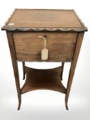 An early 20th century mahogany sewing box, on stand, width 40 cm, with key.