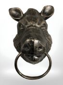 A boar head metal ring / towel holder.
