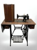An antique Singer treadle sewing machine.
