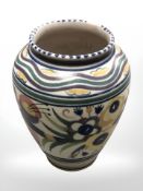 A Poole pottery vase decorated with flower, numbered 336, height 18 cm.