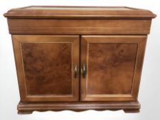 A reproduction jewellery casket with lift up lid and double doors,