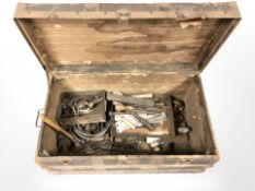 An old cane bound trunk containing wood working tools, chisels,