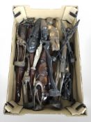 A box containing carved African wooden figures, animal figures, face plaques.