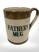 A stoneware oversized tankard 'fathers mug'.