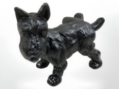 A cast iron figure of a dog.