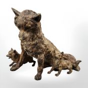 A cold painted bronze figure of a fox with two cubs, height 9 cm.