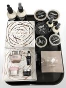 A group of new retail stock items including cologne, cream shampoo, Lancome gift set, etc.