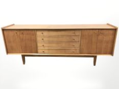 A good quality mid 20th century teak dining room suite : long sideboard , length 199 cm ,