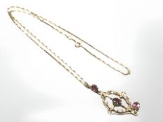 A 9ct yellow gold necklace with amethyst set pendant, length 42 cm.