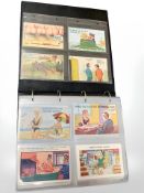 A large album containing approximately 303 humorous postcards.