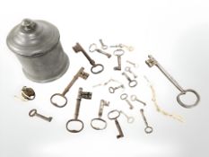 A Georgian pewter tobacco pot together with a small quantity of antique keys.