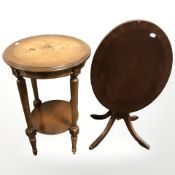 A reproduction oval occasional table and a plant stand