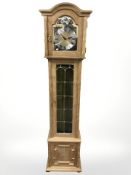 A light oak Tempus Fugit longcase clock