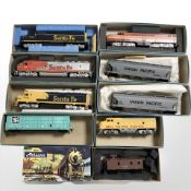 A group of Atheann Trains in Miniature series locomotive engines and rolling stock,