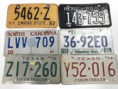 Six American car registration plates.