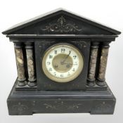 A Victorian black slate and variegated mantel wall clock, width 36 cm.
