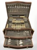 A good quality mahogany and satinwood banded cutlery chest of silver plated cutlery.