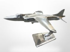 An aluminium harrier jet on stand.