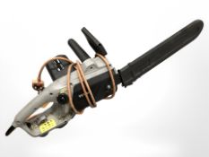 A Titan electric chain saw